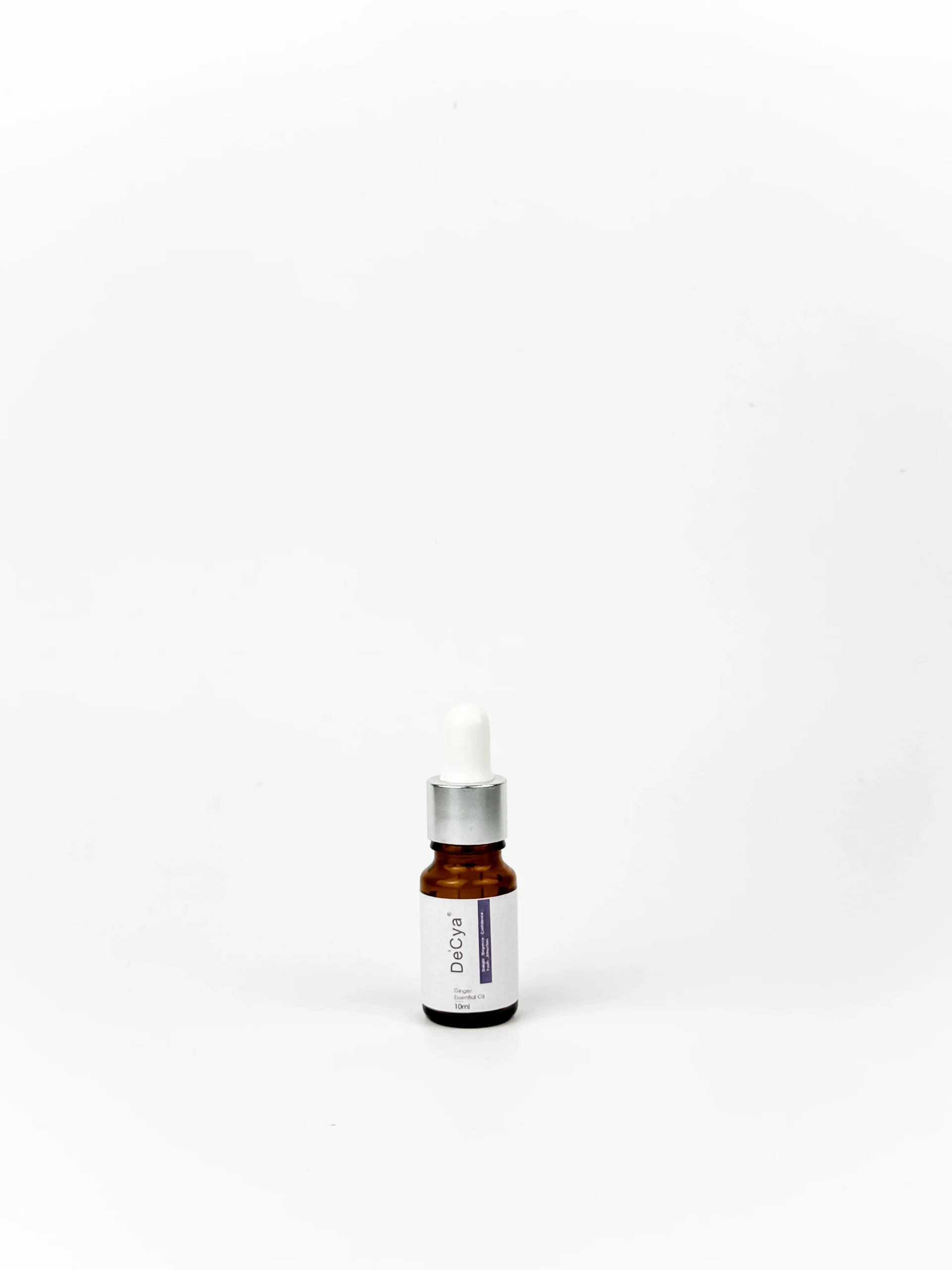 Ginger Essential Oil in a brown bottle, created by a top essential oil manufacturer in Malaysia, providing OEM essential oil options